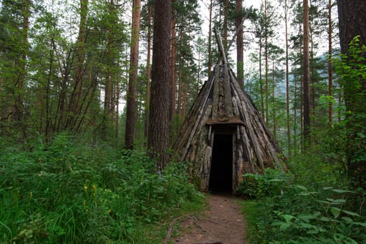 Old hovel of ancient altai people in the forest, Altai, Siberia, Russia