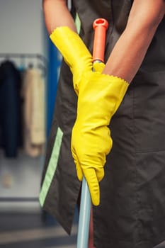 Cleaning concept. Closeup photo of woman cleaning at the home