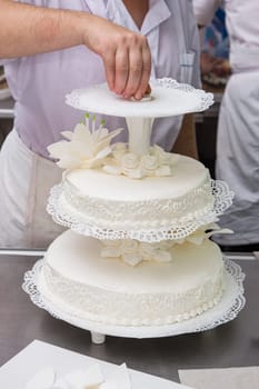 Tasty beauty wedding cake with flowers