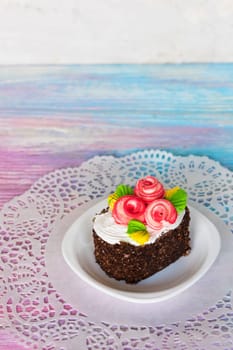 Tasty mini cake on a color gradient background