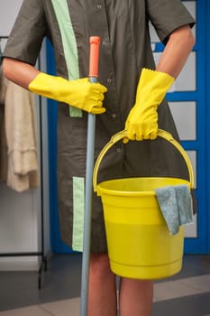 Cleaning concept. Closeup photo of woman cleaning shopping mall