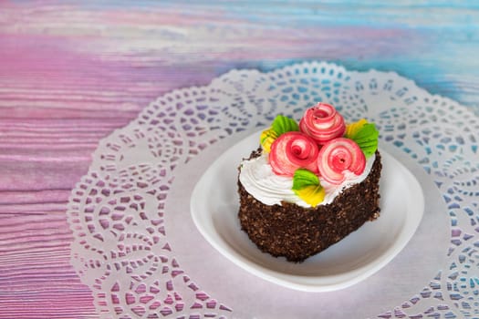 Tasty mini cake on a color gradient background