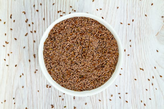 Top view of psyllium seeds in a white porcelain bowl