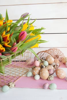 Painted eggs and fresh tulips for Easter