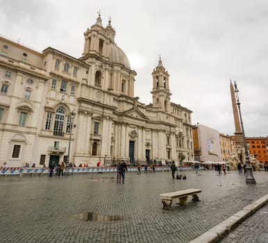 Rome, Italy, march 2015: panoramic view of the famous Piazza Navona with people on a rainy day in Rome, Italy