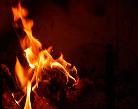 close-up view of warm fire burning in a fireplace