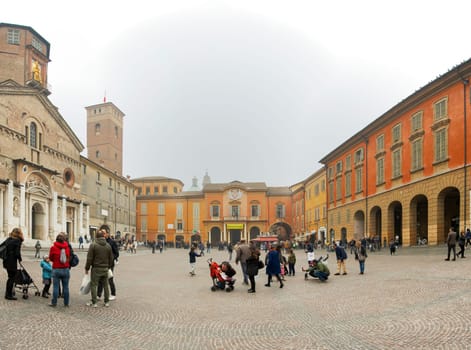 Reggio Emilia, Italy, november 2017: panoramic view of the Piazza del Duomo (now Piazza Prampolini) in the city center of Reggio Emilia in Italy with people enjoying the outdoors