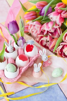 Fresh colorful tulips and froehliche decoration for Easter