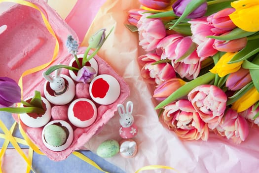 Fresh colorful tulips and froehliche decoration for Easter