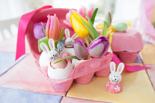 Fresh colorful tulips and froehliche decoration for Easter