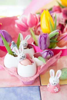 Fresh colorful tulips and froehliche decoration for Easter