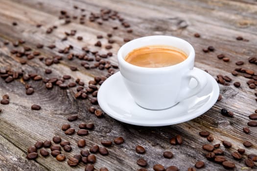 espresso cup with a lot of coffee beans