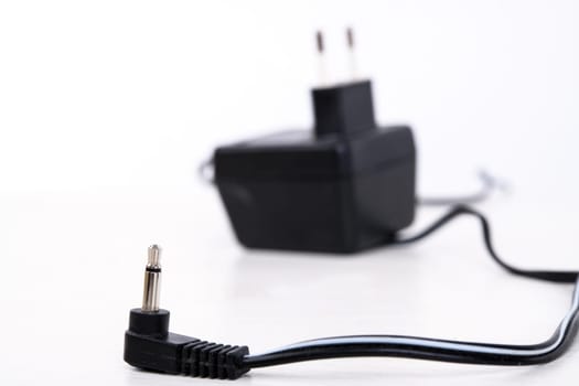 power adapter with jack plug in front of white background