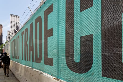 New York, USA - June 08, 2015: Ground Zero with fence for works with the inscription World trade Center. Lower Manhattan.