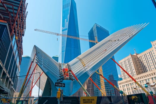 New York, USA - June 08, 2015: Ground Zero with the World Trade Center One and Transportation building late in the day in Lower Manhattan.