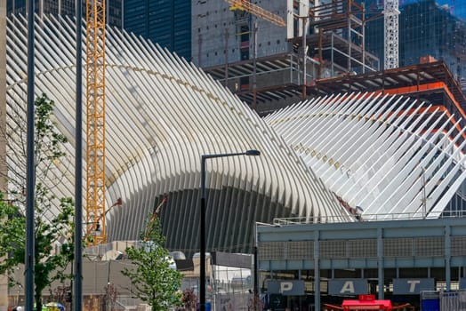 New York, USA - June 08, 2015: Ground Zero with the World Trade Center One and Transportation building late in the day in Lower Manhattan.