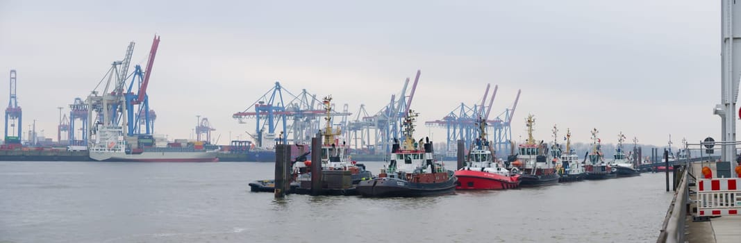 HAMBURG, GERMANY - DECEMBER 20, 2016: Tug boats waiting to come n action in the Hamburg port area