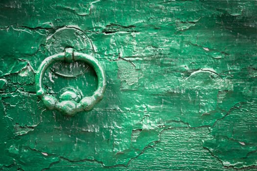 Green wood old knock door. Vintage style. Ideal for backgrounds and texture. Space for text.