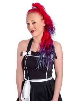 Woman with red harps and petticoat dress poses against a white background