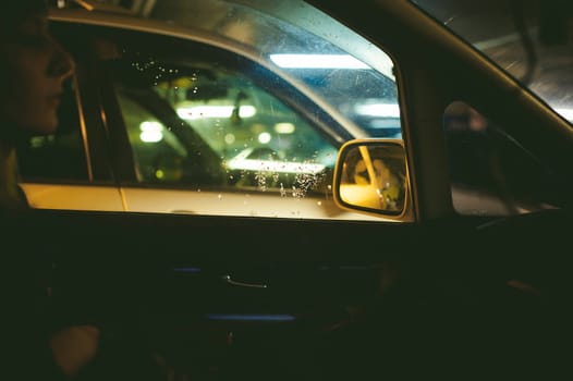 the girl in the car in the parking lot