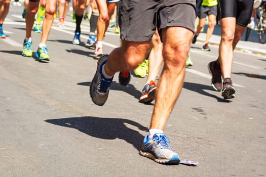 detail of running shoes of marathon runners