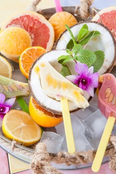 Colourful popsicles with fresh fruits