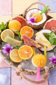 Colourful popsicles with fresh fruits