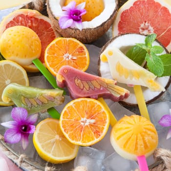 Colourful popsicles with fresh fruits