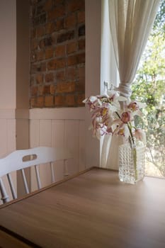Decorative flower vase on wooden table