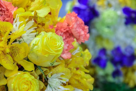 Beautiful bouquet flowers of yellow Roses, yellow Orchid, pink Carnation and white Chrysanthemum