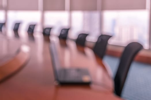 Blur image of empty boardroom with window cityscape background. Business concept