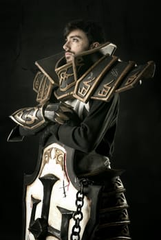 Young man cosplaying with fantasy knight costume