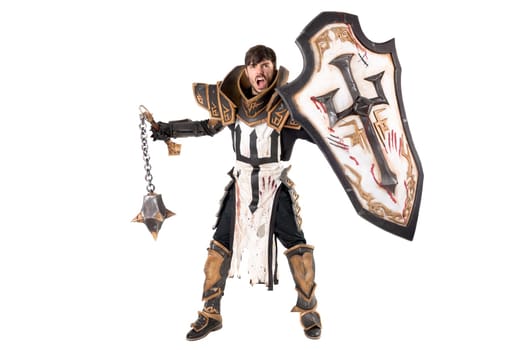 Young man cosplaying with fantasy knight costume