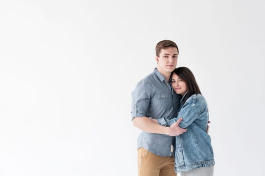 young couple, man and woman in trendy jeans clothes, studio shot on white background
