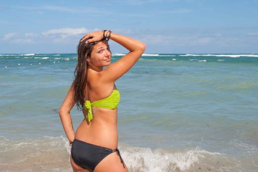 Beautiful and sexy girl posing at the beach in dominican republic