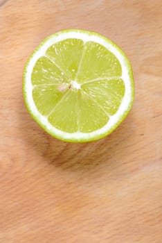 Half fresh lemon on wood background