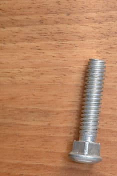 One bolt on wood blur background