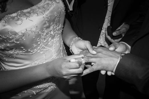 The bride wear the ring on the husband finger