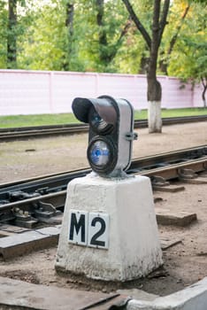 traffic light in a railway station in a park