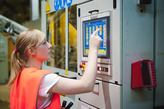 Female worker on beer factory. portrait woman in robe, standing on background line Food production, Inspection management control Equipment for production and bottling finish product end-user buyer