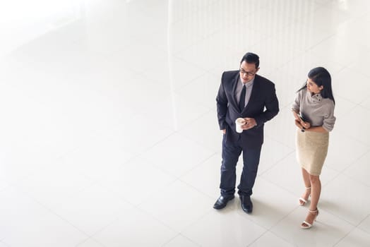 Top view, Asian business people, man and woman, talking about ideas, copy space