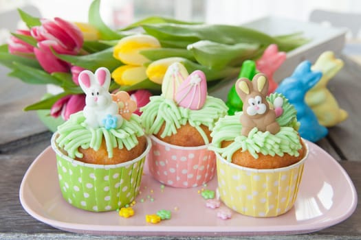 Small colorfully decorated cupcake for Easter