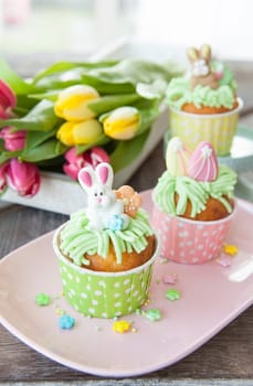 Small colorfully decorated cupcake for Easter