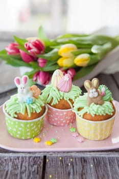 Small colorfully decorated cupcake for Easter