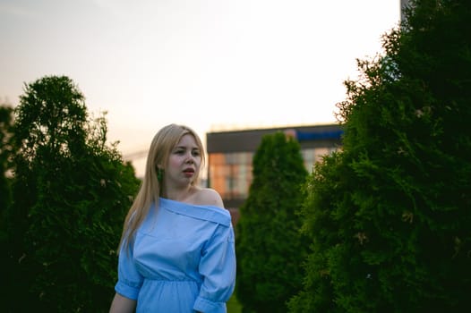 portrait of a cute young blond woman with a summer day