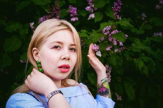 portrait of a cute young blond woman with a summer day