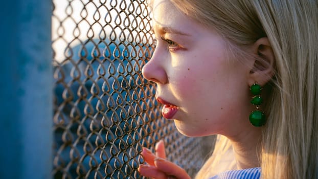 portrait of a cute young blond woman with a summer day
