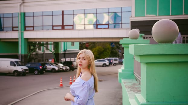 portrait of a cute young blond woman with a summer day