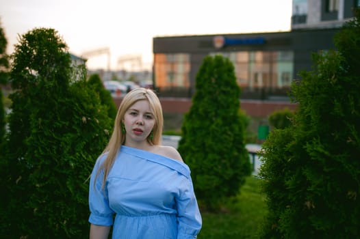 portrait of a cute young blond woman with a summer day