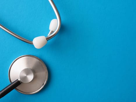 Stethoscope on a blue background, heath care or medical concept background